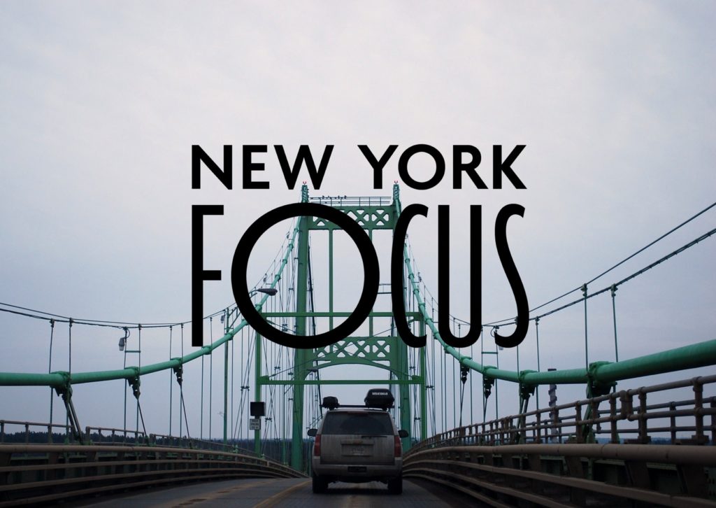 Picture from NY Focus Facebook page that shows an SUV driving on a bridge in New York, with the words "New York Focus" in front and center.