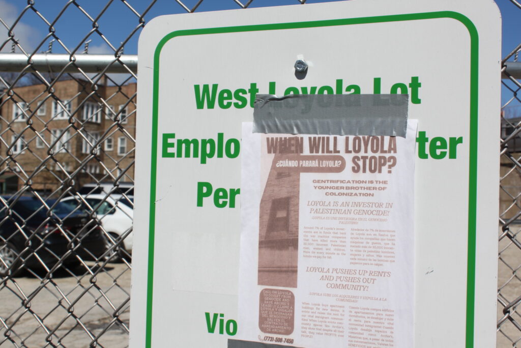 Dirt lot, demolished years ago by Loyola, with a flyer titled "WILL WILL LOYOLA STOP?" taped by an unknown passerby on Loyola's sign.